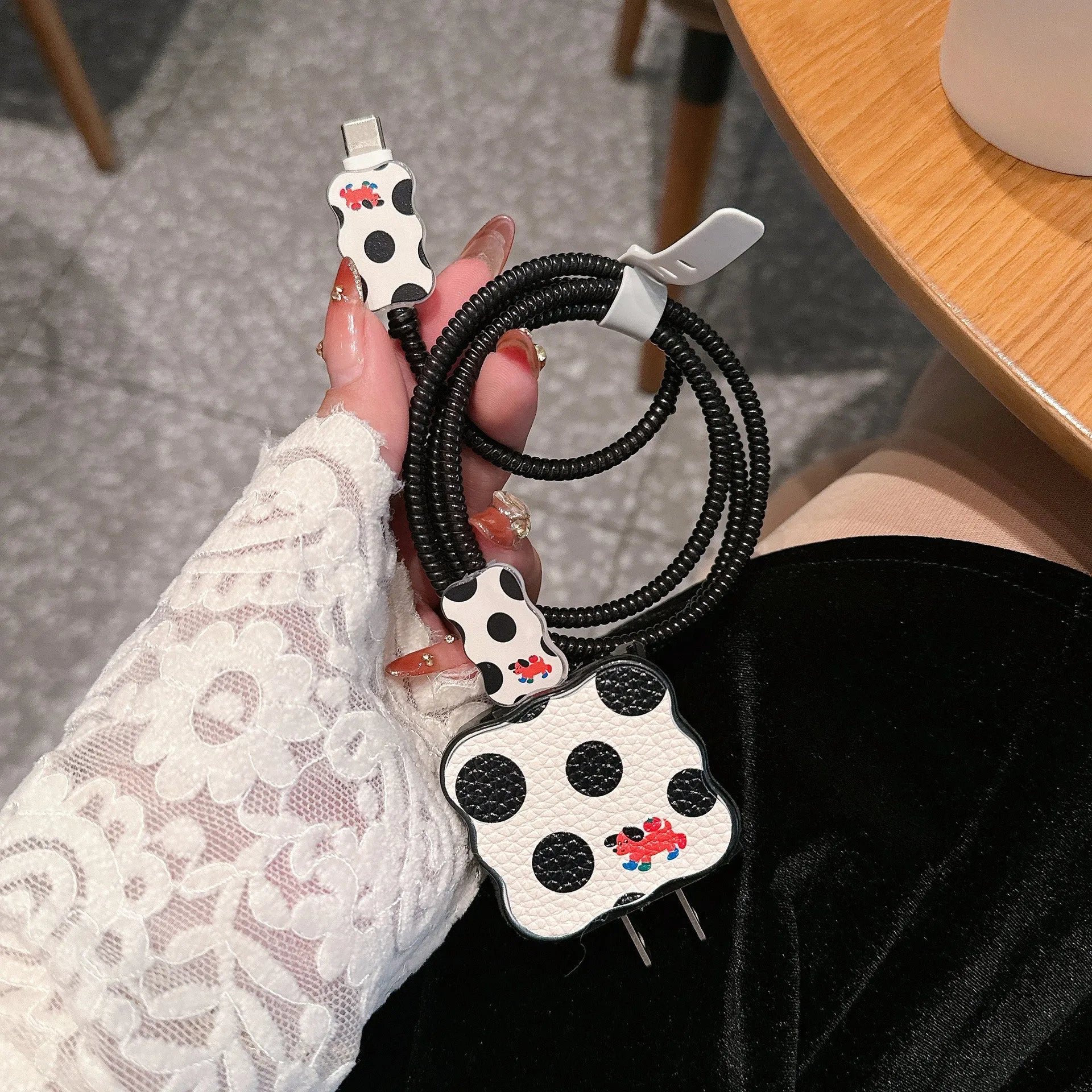 Set of four cartoon-design lambskin USB cable protection sleeves for 18W and 20W fast chargers.