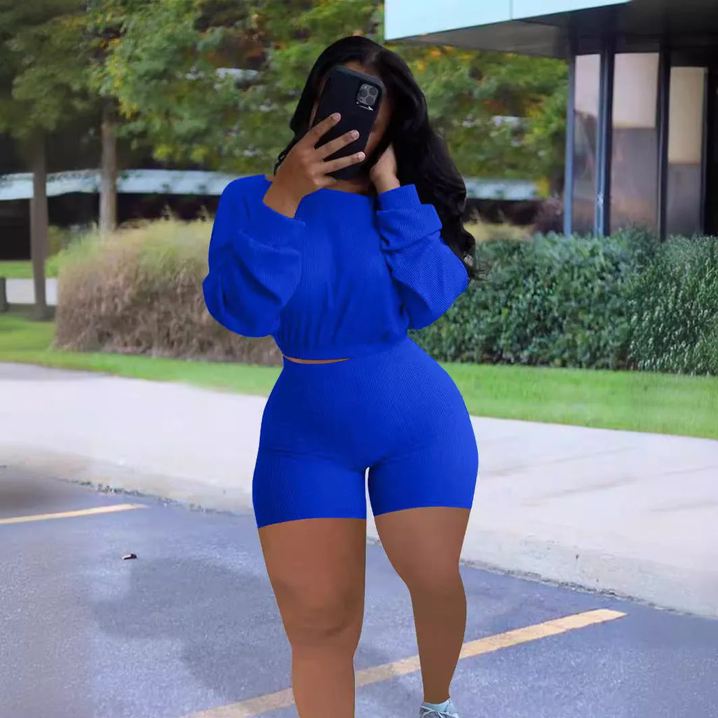 Women's solid colour off-the-shoulder top with sunken stripe detail and matching shorts, a two-piece set with long sleeves.