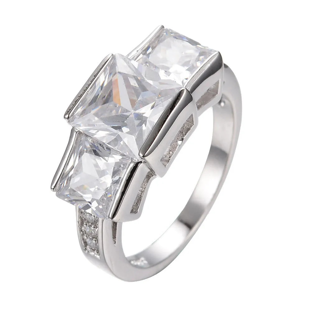 Geometric copper women's ring in champagne colour on a size no.8 finger, showing metal band and electroplated finish.