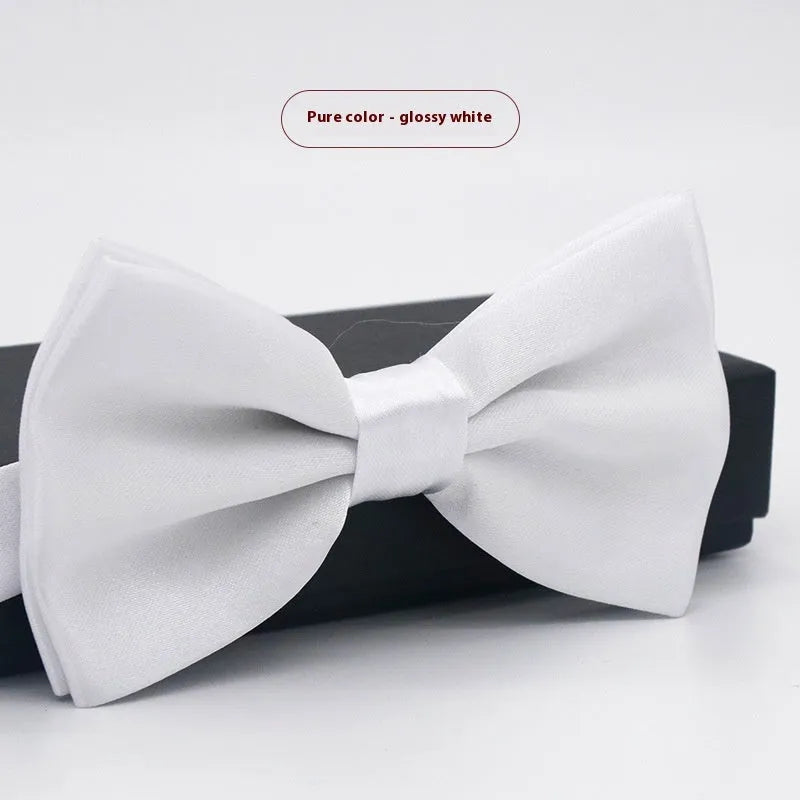 Solid colour flat head bow tie for formal wear in multiple colours including black, red, and blue.