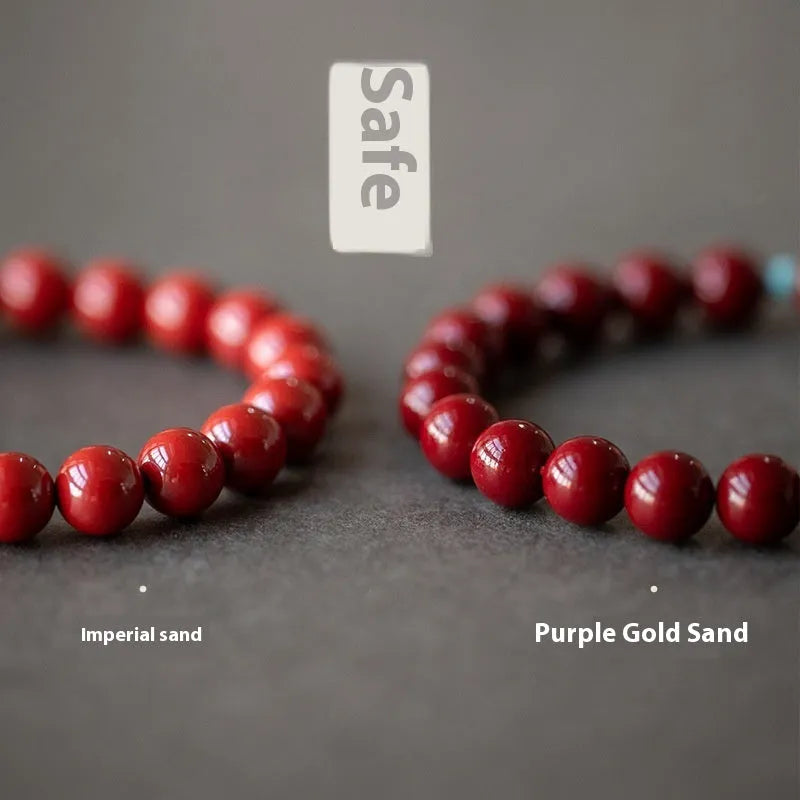Purple gold sand cinnabar bead bracelet with geometric ellipse shapes on a wrist.