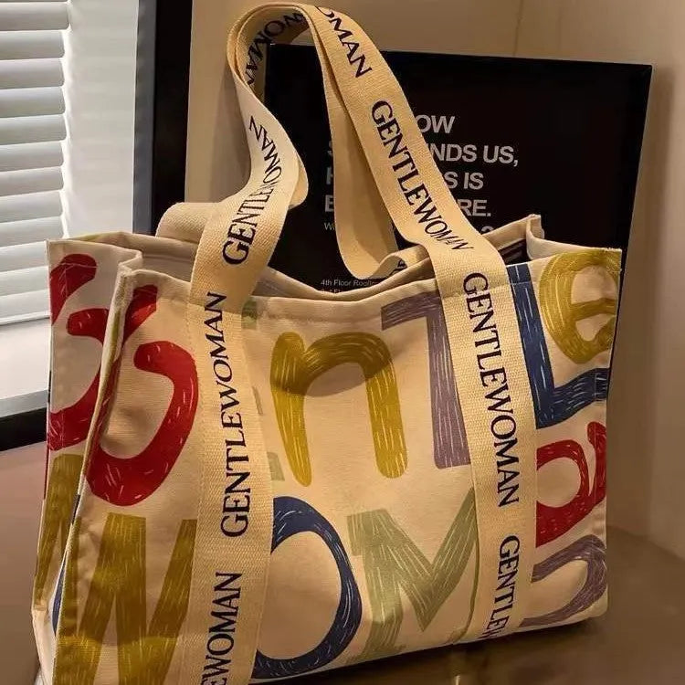 Large capacity cotton canvas tote bag with printed design options including black letter, coloured letter and pattern styles