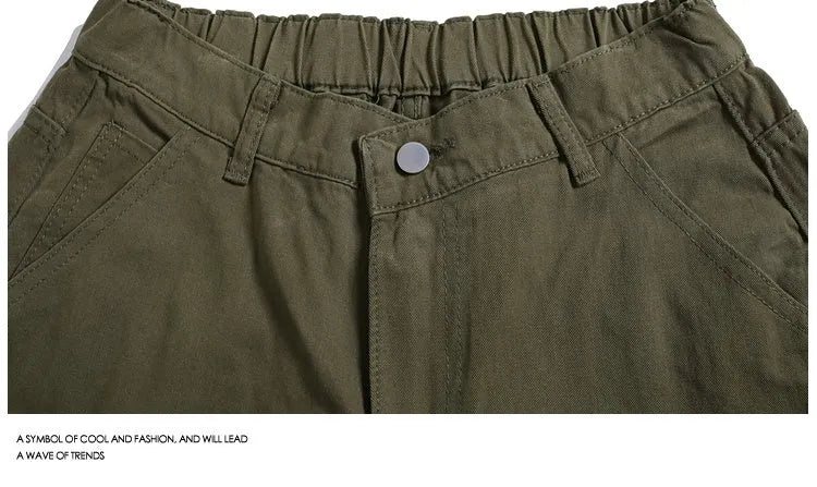 Women's workwear-style cropped pants in wide-leg shorts design with rivet detailing