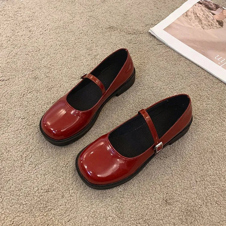 Women's flat-heeled leather shoes with round toe in red, black, and grey colour options showing vintage French styling