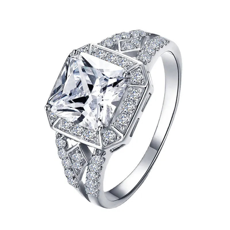 Women's geometric zircon ring with hollow design and platinum colour finish showing quadrilateral decorative elements