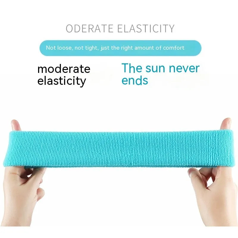 Elastic solid colour sports anti-sweat headband in blue on a white background.