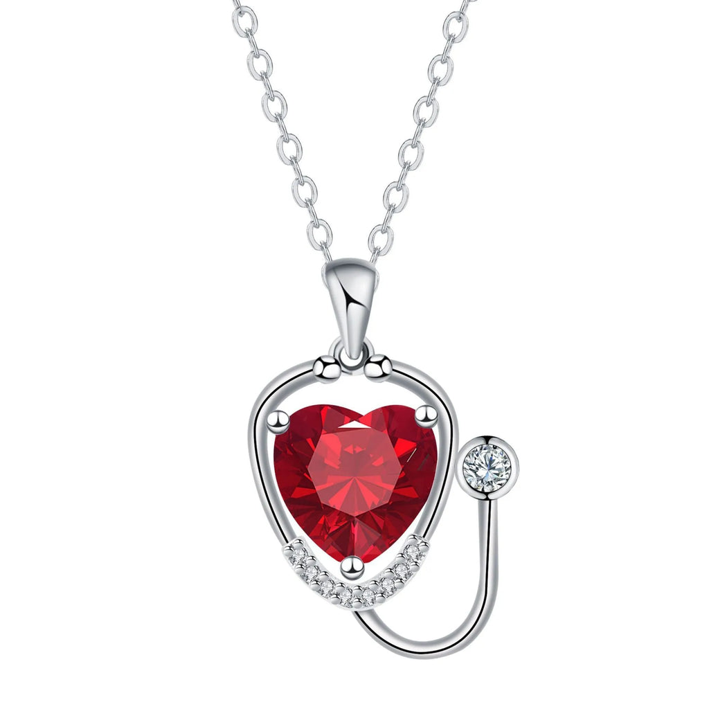 Women's copper stethoscope necklace with red diamond colour pendant on model