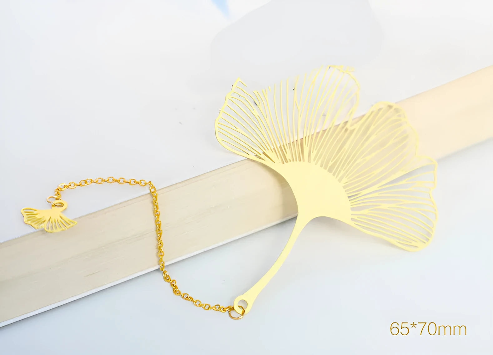 Brass bookmark with hollow-cut leaf design and matching rose gold metal tassel