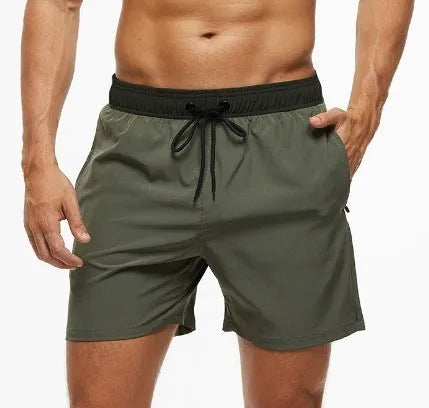 Men's blue running shorts with a stitching waistband, drawstring, and a side zippered pocket.