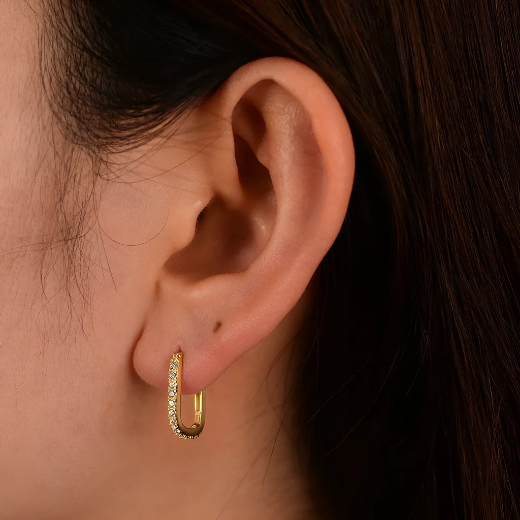 Sterling silver oval zircon ear clips with geometric design in white or yellow finish