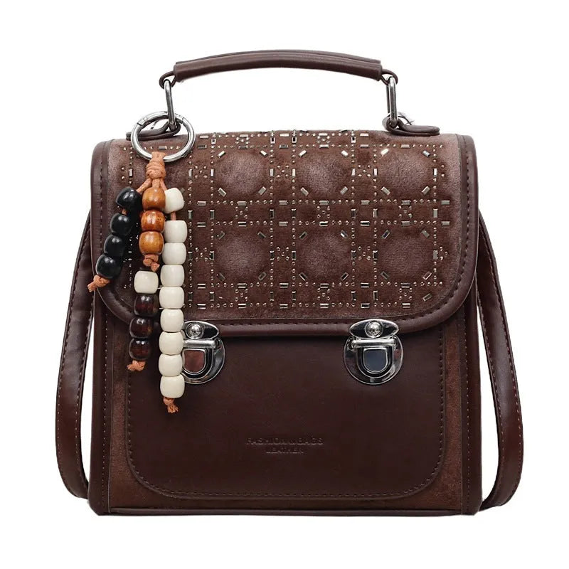 Small square PU leather messenger backpack for women with texture finish in black colour