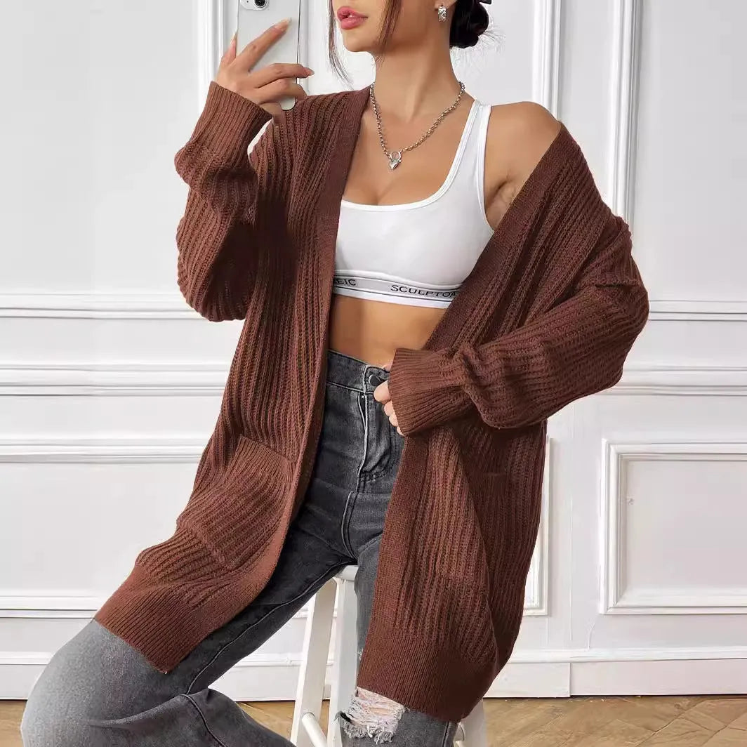 Women's loose fit acrylic cardigan with double pockets in dark green colour