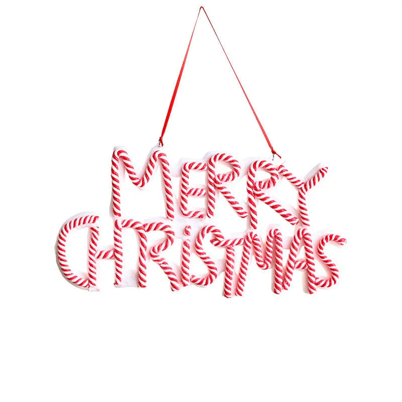 Merry Christmas letter plate polymer clay tree ornament in red, white and green plastic hanging on a tree branch