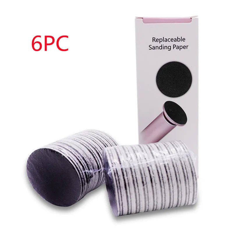 Electric foot callus remover with sandpaper disc attached for removing dead skin and calluses from heels