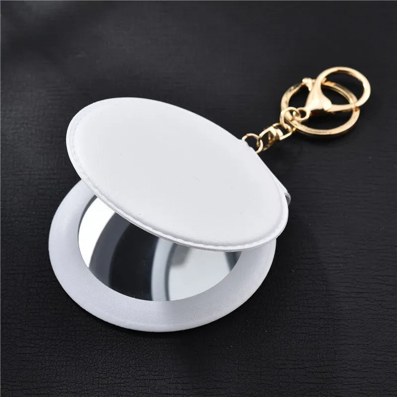 Compact round ladies leather makeup mirror with 8cm diameter glass surface and golden buckle
