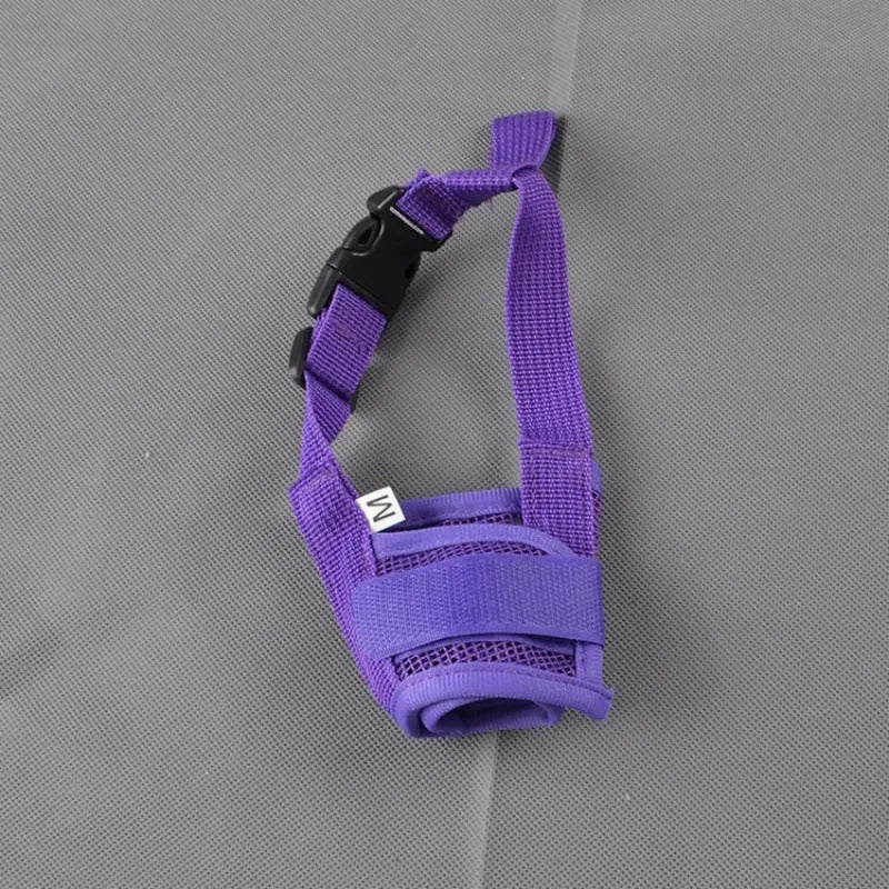 Adjustable plastic dog safety muzzle in black, shown on a size chart.