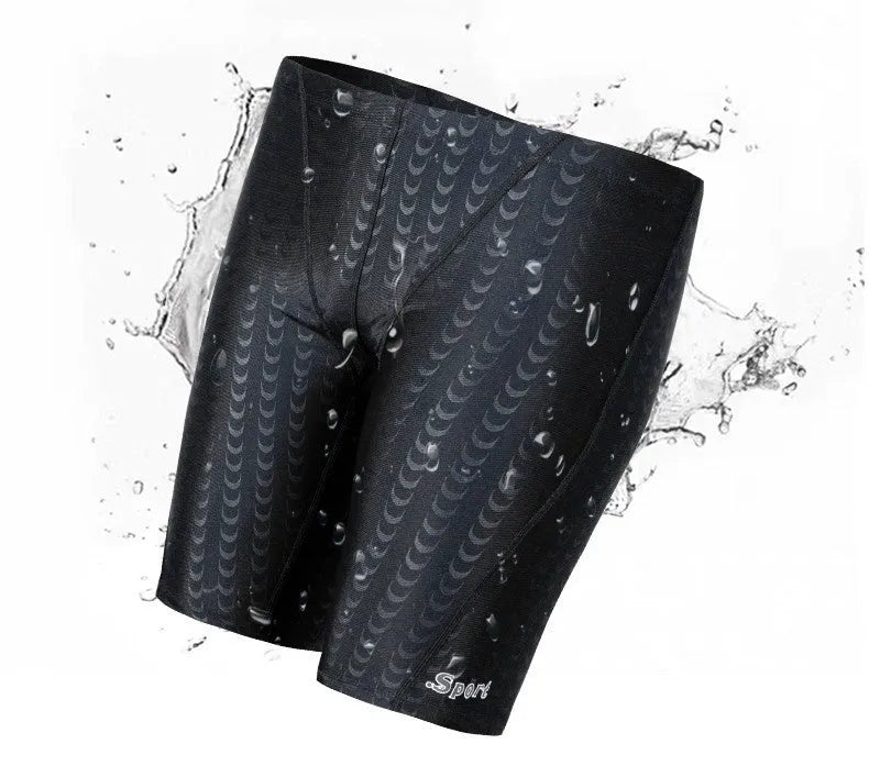 Men's solid colour waterproof shark skin fabric swimming trunks in pool setting