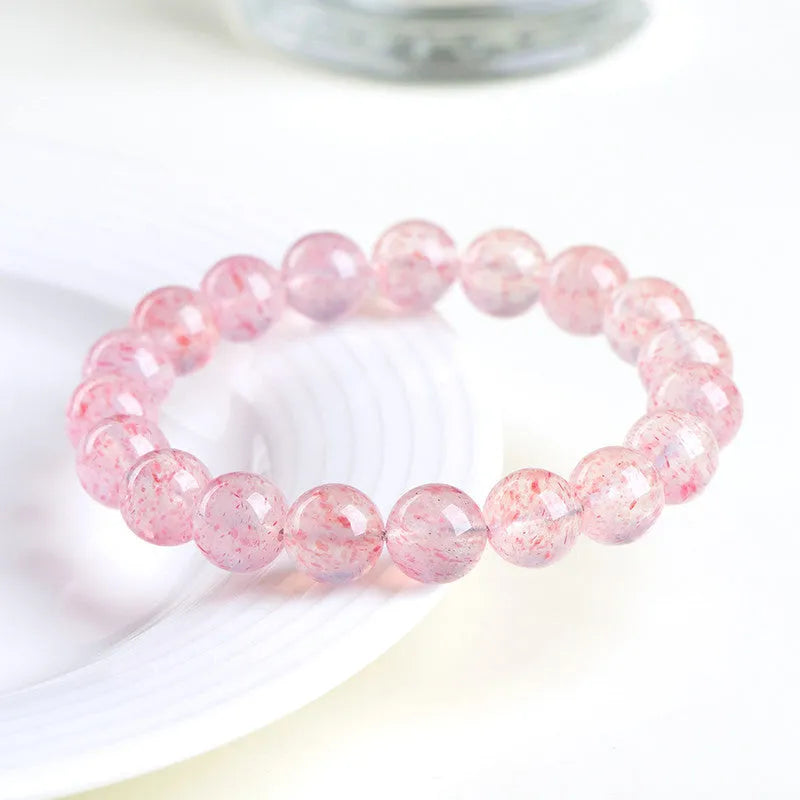 Natural white water strawberry quartz crystal bracelet with geometric beads.