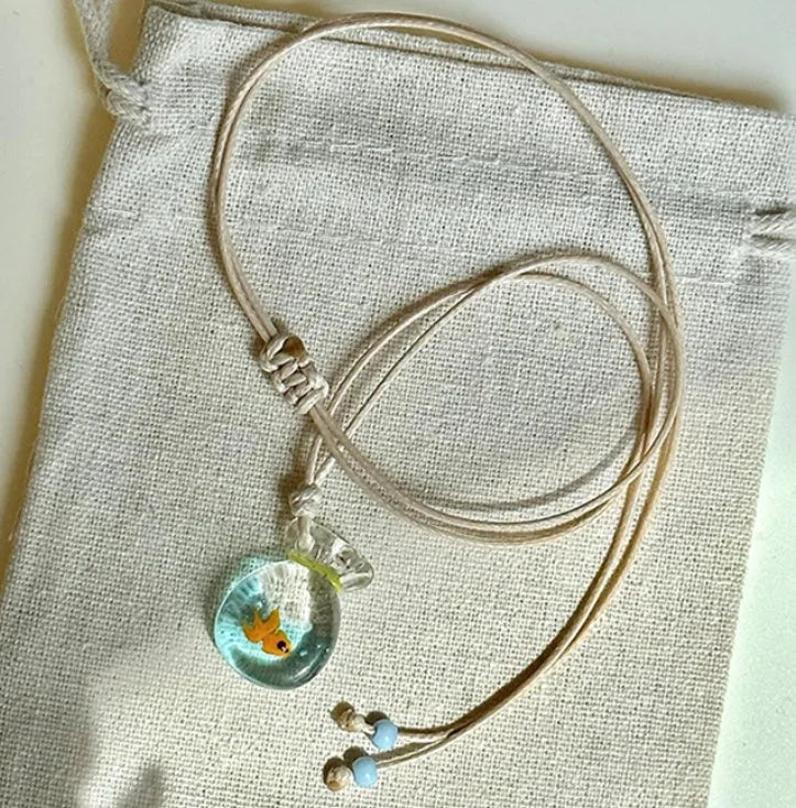 Women's necklace with coloured glaze joker skirt pendant on a cotton linen clavicle chain