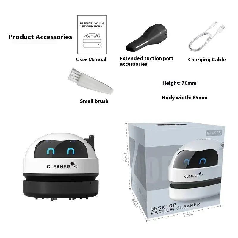 Handheld desktop vacuum cleaner in blue rocket design with USB charging cable on a wooden desk.