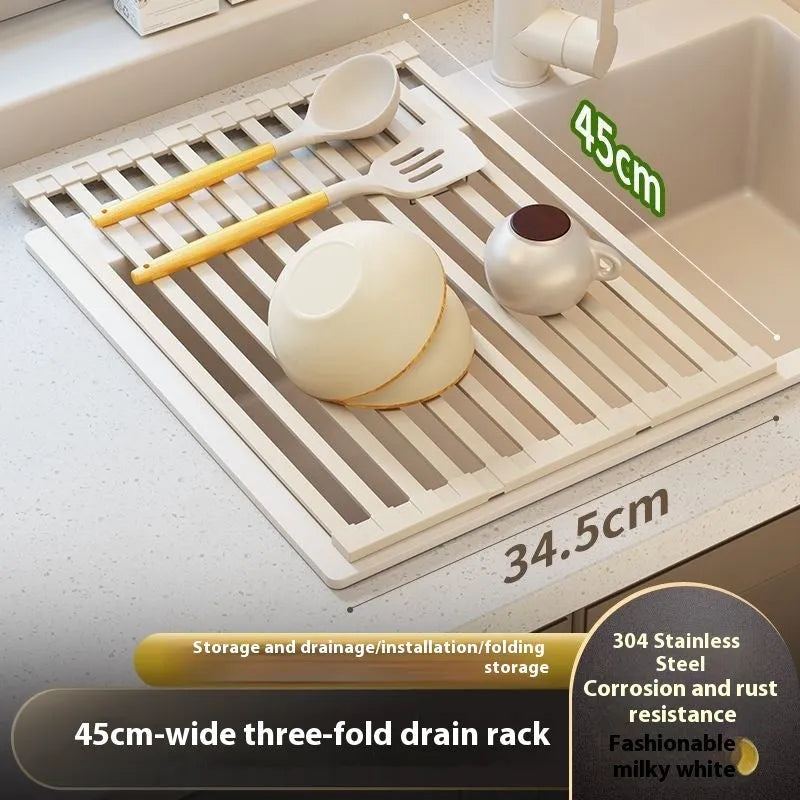 Milky white foldable stainless steel kitchen draining rack shown in a sink.