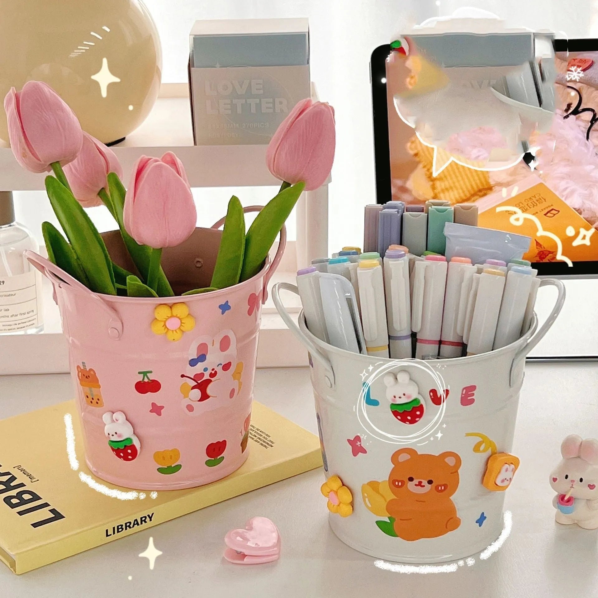 Round metal desktop pen holder showing colour options including green, pink, red, white and yellow