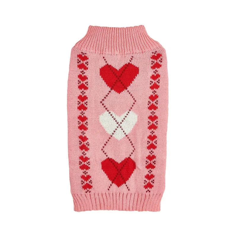 Red dog sweater with a white love heart and bow design on a small dog.