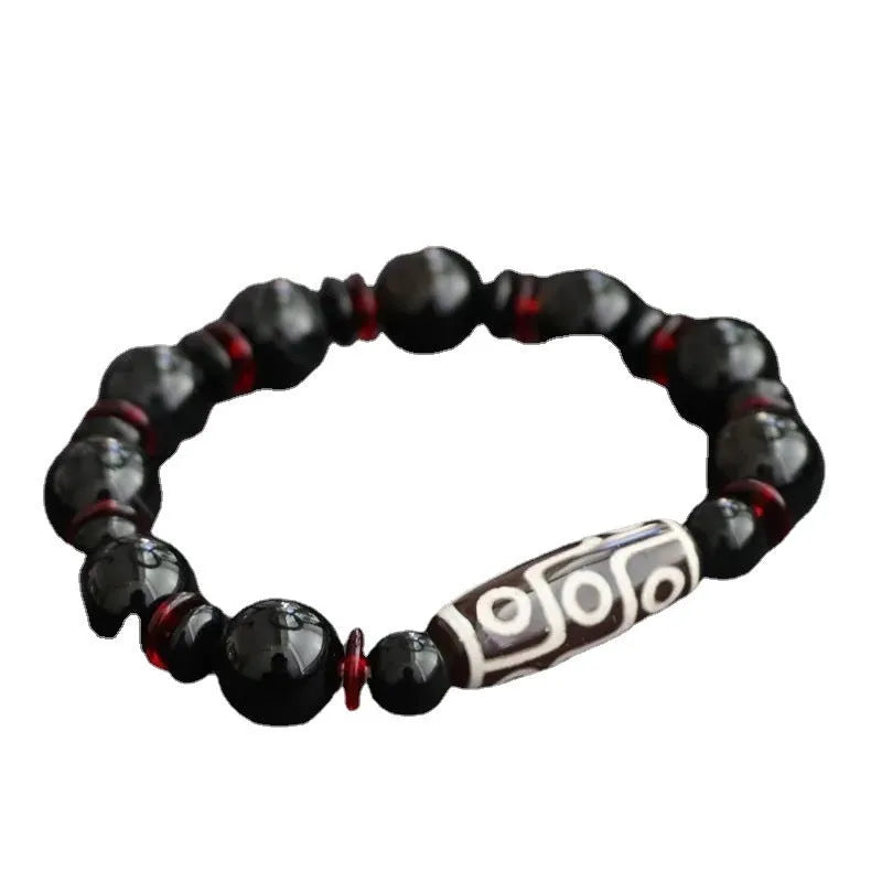 Black agate dzi bead bracelet with chalcedony stones in geometric design
