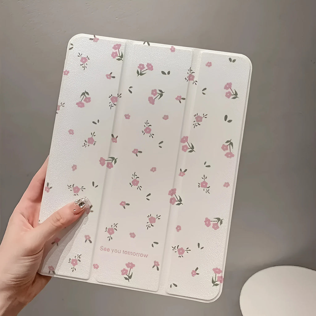 Transparent iPad case with floral cartoon pattern showing tri-fold stand position