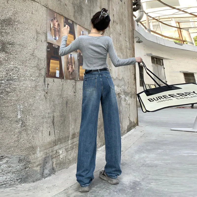 Women's high-waisted retro straight jeans in medium blue denim, showing straight leg and high waist silhouette.