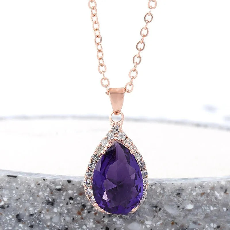 Rose gold geometric drop necklace with rhinestone details in pink colour option