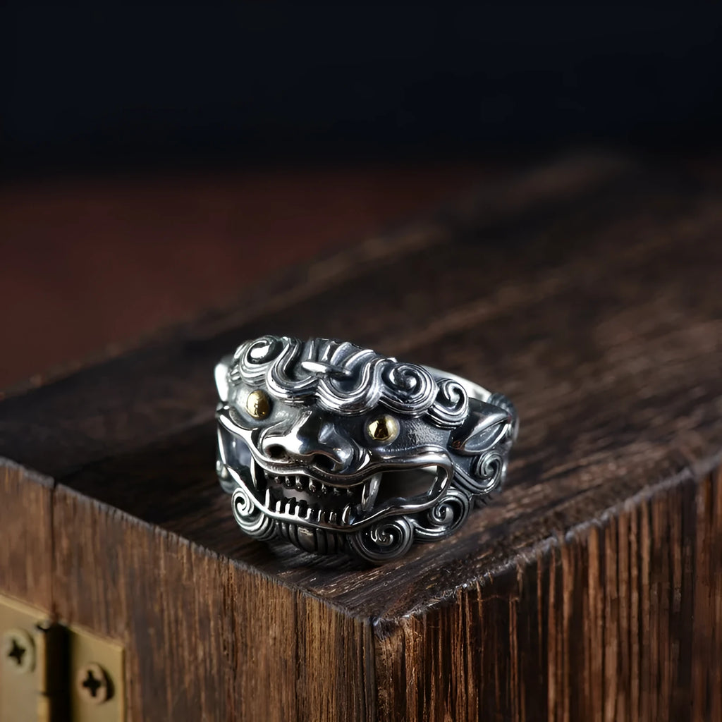 Silver open style diamond ring with a detailed jibeast and animal zodiac pattern.