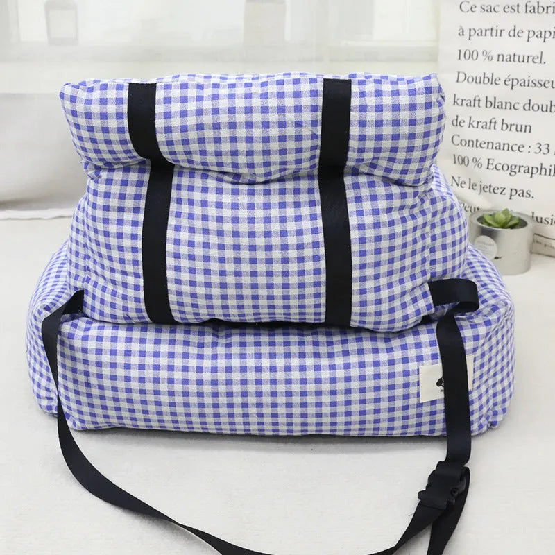 Grey and blue plaid cloth dog car travel nest carriers in two sizes for pet outings.