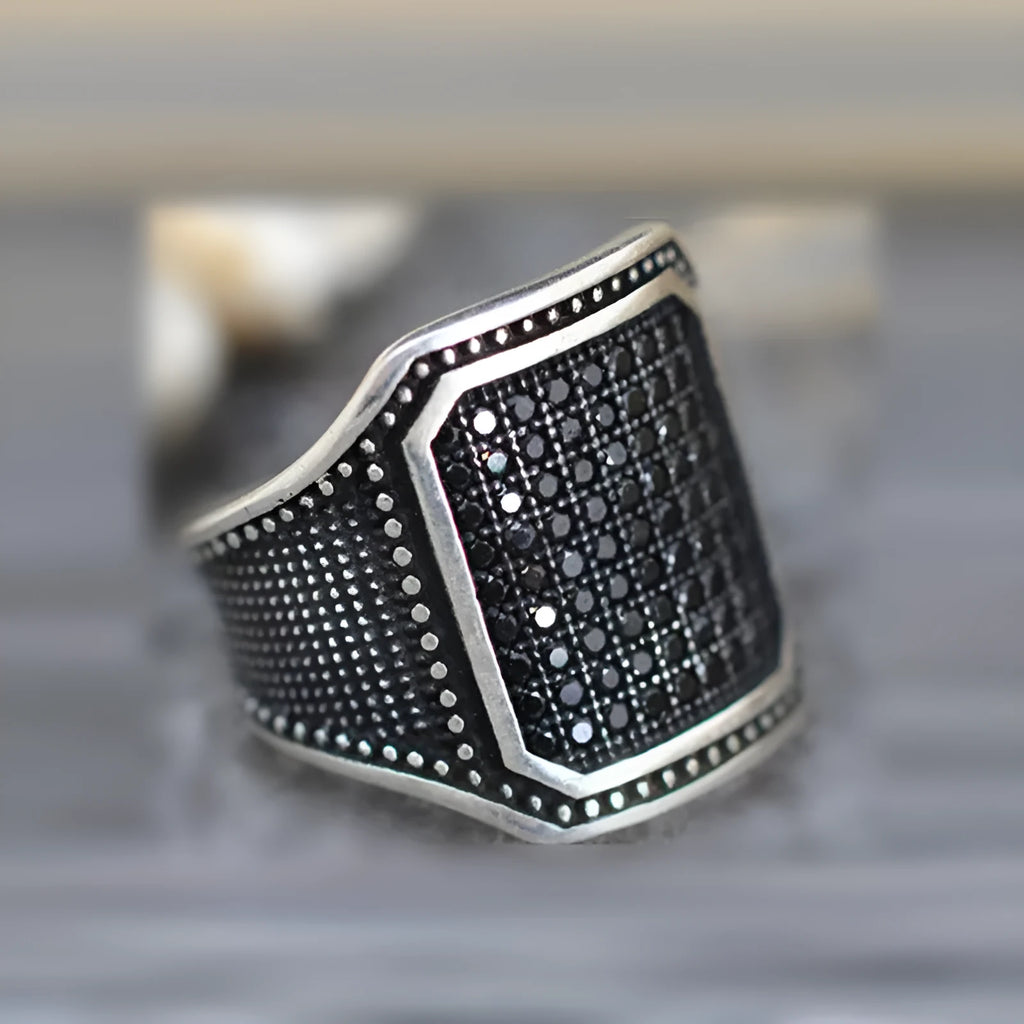 Black alloy ring with copper inlay and zircon detailing showing European and American style