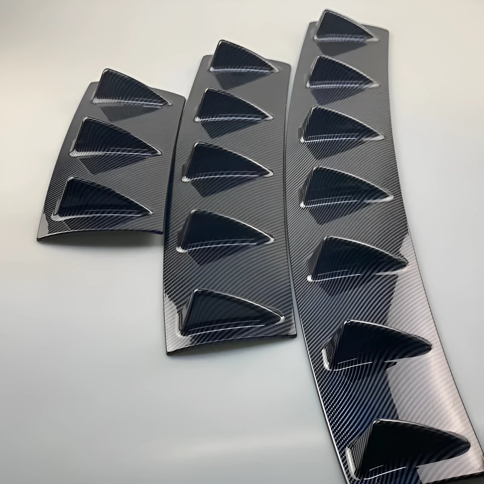 Automotive universal rear spoiler made of ABS plastic in bright black finish for GM cars