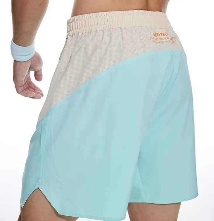Men's loose grey workout shorts with an elastic lace-up waistband for gym training