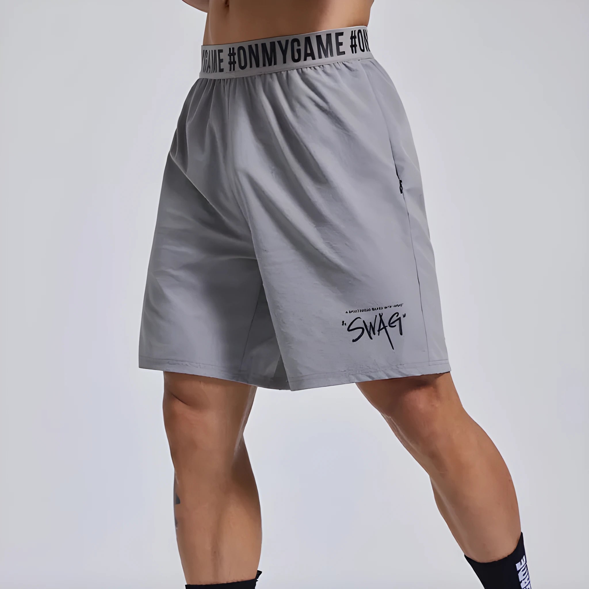 Men's black breathable sports shorts with elastic waistband and loose cropped design