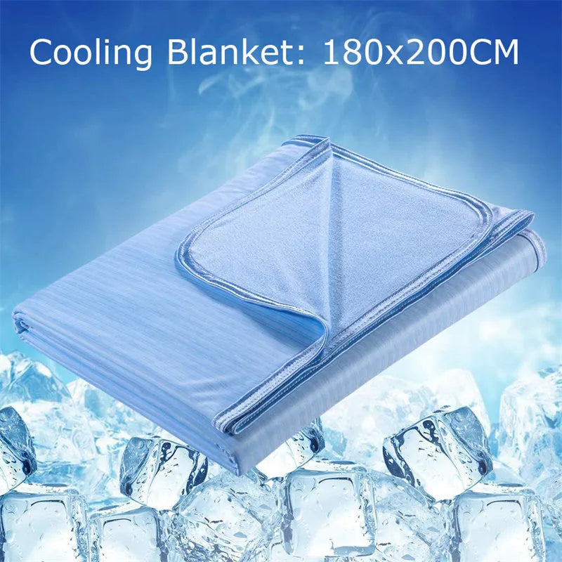 A blue polyester cooling blanket with Q-Max 0.4 technology laid on a bed.