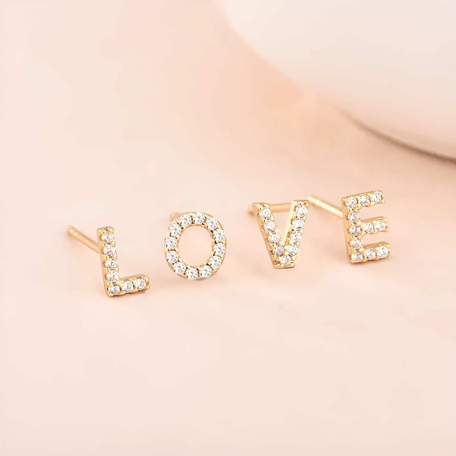 Brass gold plated alphabet letter earrings showing single letter from A-Z range with zircon detailing