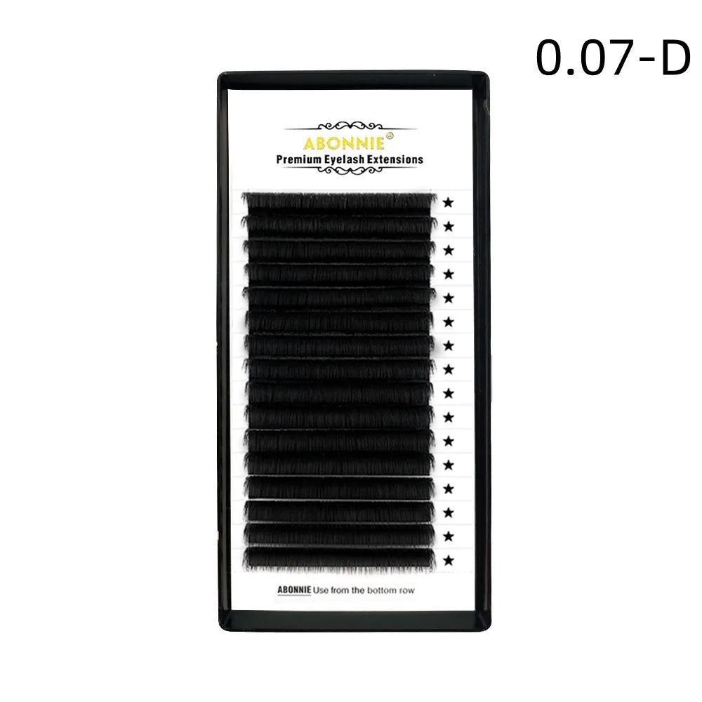 Pair of dense 16-row false eyelashes made from matte wool mink hair, showing voluminous length.