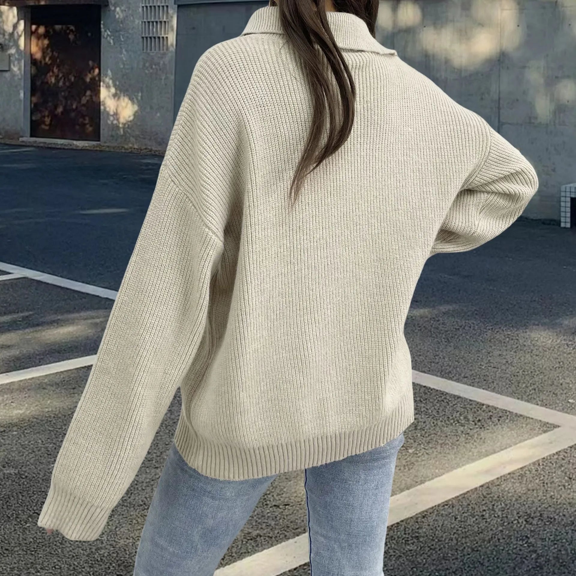 Light khaki women's alpaca wool sweater with a diagonal front zip and loose lapel turtleneck collar.