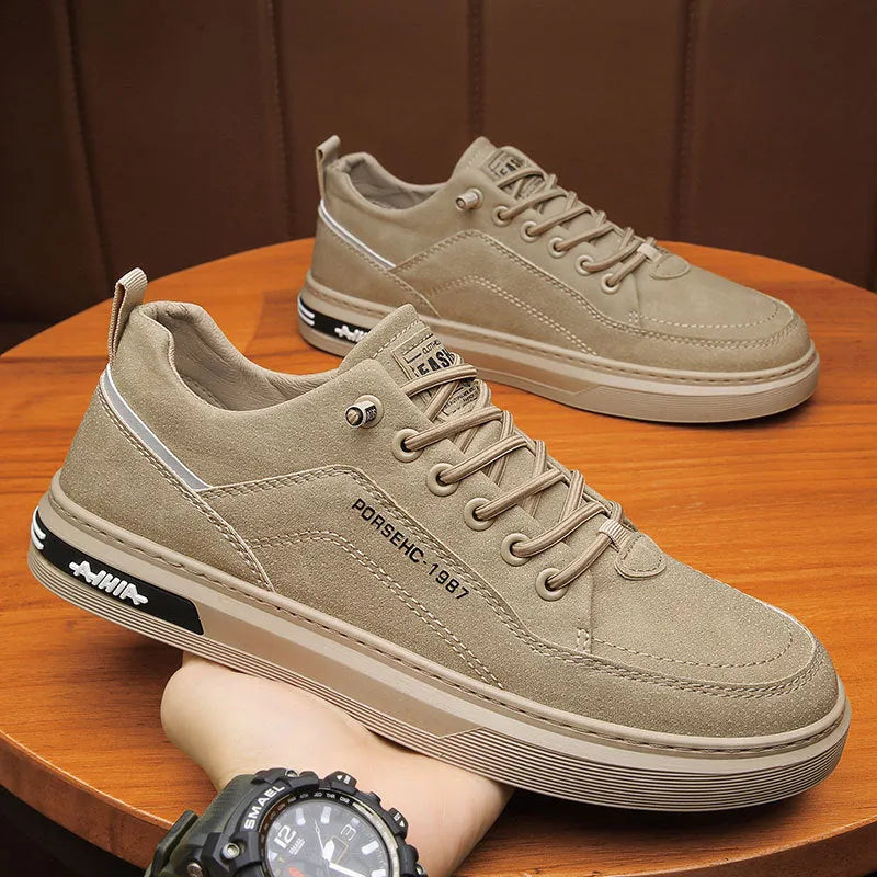Men's black low-top casual work shoes with a rubber sole and artificial PU upper.
