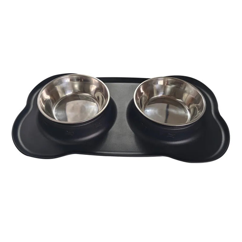Large silicone double dog bowl in blue with two compartments for food and water on a kitchen floor.