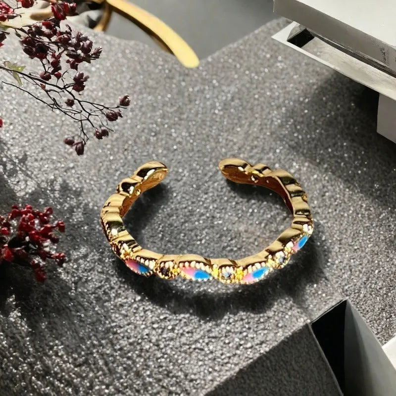 Adjustable copper ring with vintage oil dripping gourd design, zircon inlay, and floral bow shapes in New Chinese style.