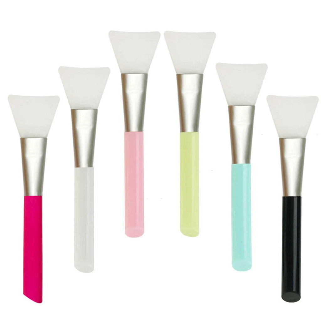 Reusable soft silicone spatula for applying face and body masks in various colours.