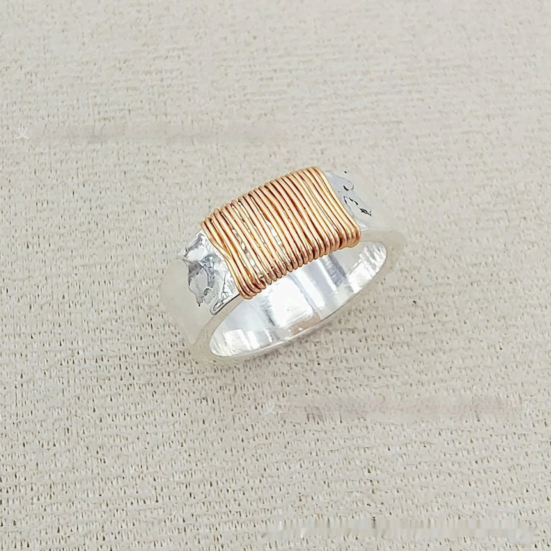 Copper geometric wide-face bracelet with irregular coil design in silver gold electroplated finish