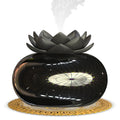 Pure black Lotus ultrasonic aromatherapy humidifier with round shape and USB cable.