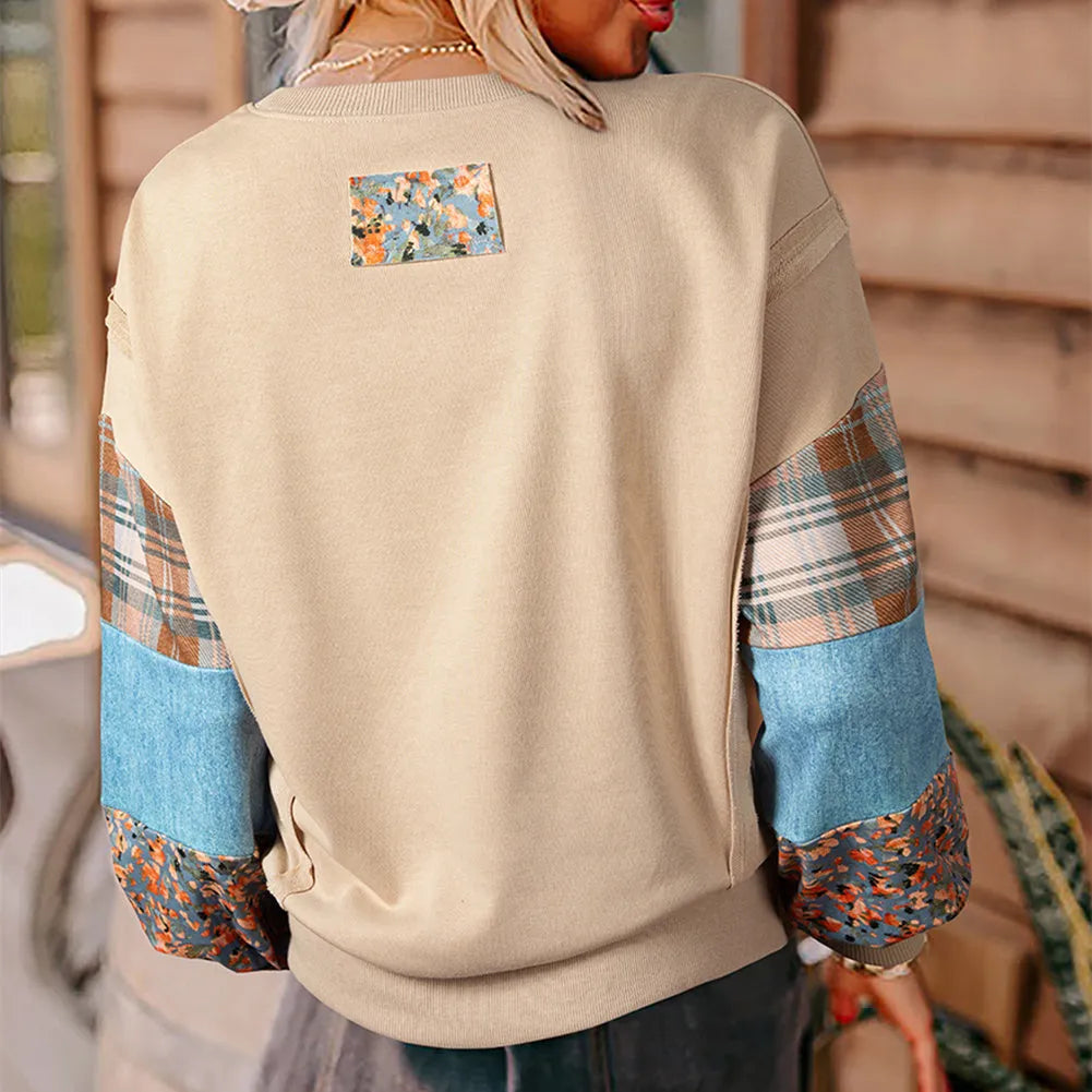Women's loose plaid long-sleeved casual top in apricot colour on a hanger.