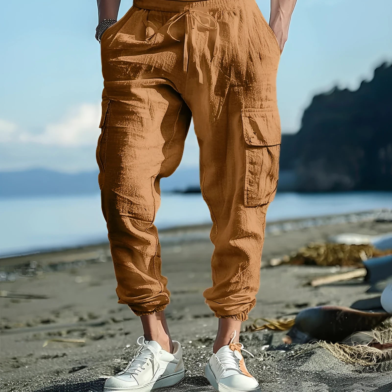 Men's loose-fit linen trousers in Army Green with ankle-tied cuffs and multiple pockets.