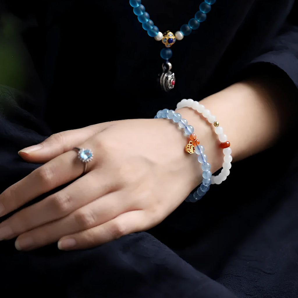 Icy translucent natural aquamarine crystal bracelet with 8mm round beads and a blessing card.